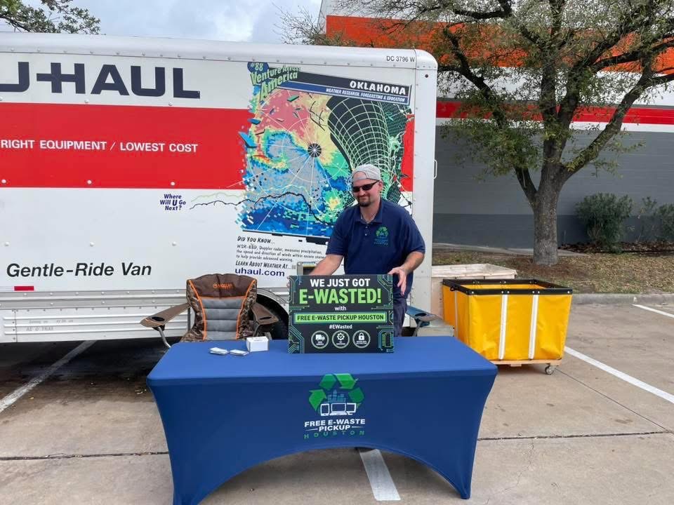 Free E-Waste Pickup Houston team set up at the Jersey Village community e-waste collection event with branded table and collection bins